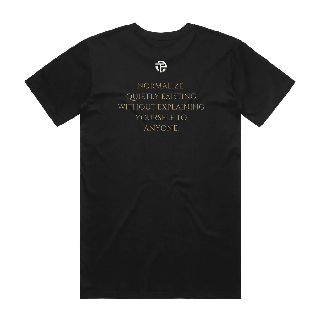 Quietly Existing tee back — the quote 'Normalize quietly existing without explaining yourself to anyone' on a black TPC tee