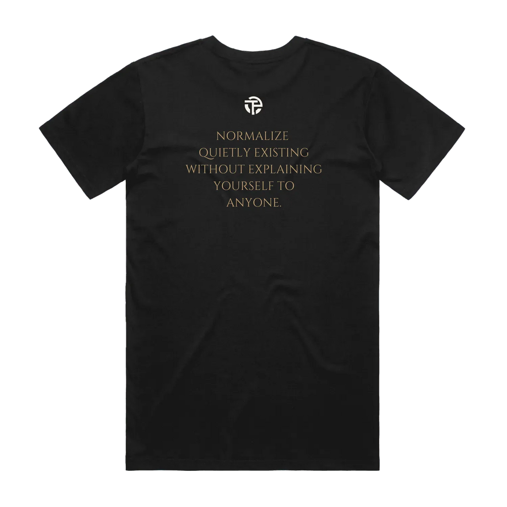 Quietly Existing Variant B tee back — the quote 'Normalize quietly existing without explaining yourself to anyone' on a black TPC tee