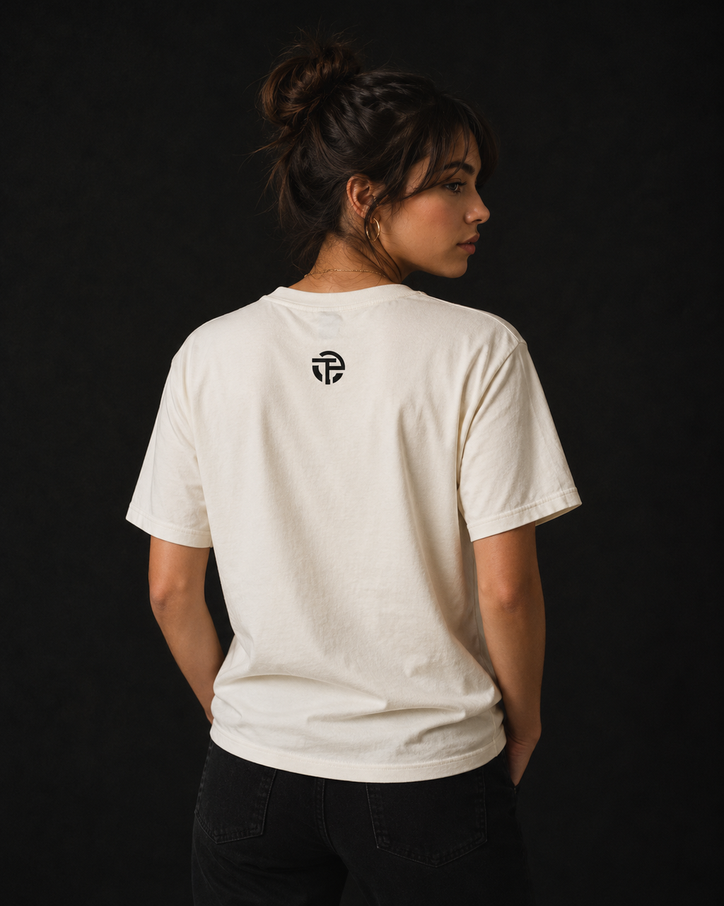 Model wearing the TPC Resilience natural tee, back view