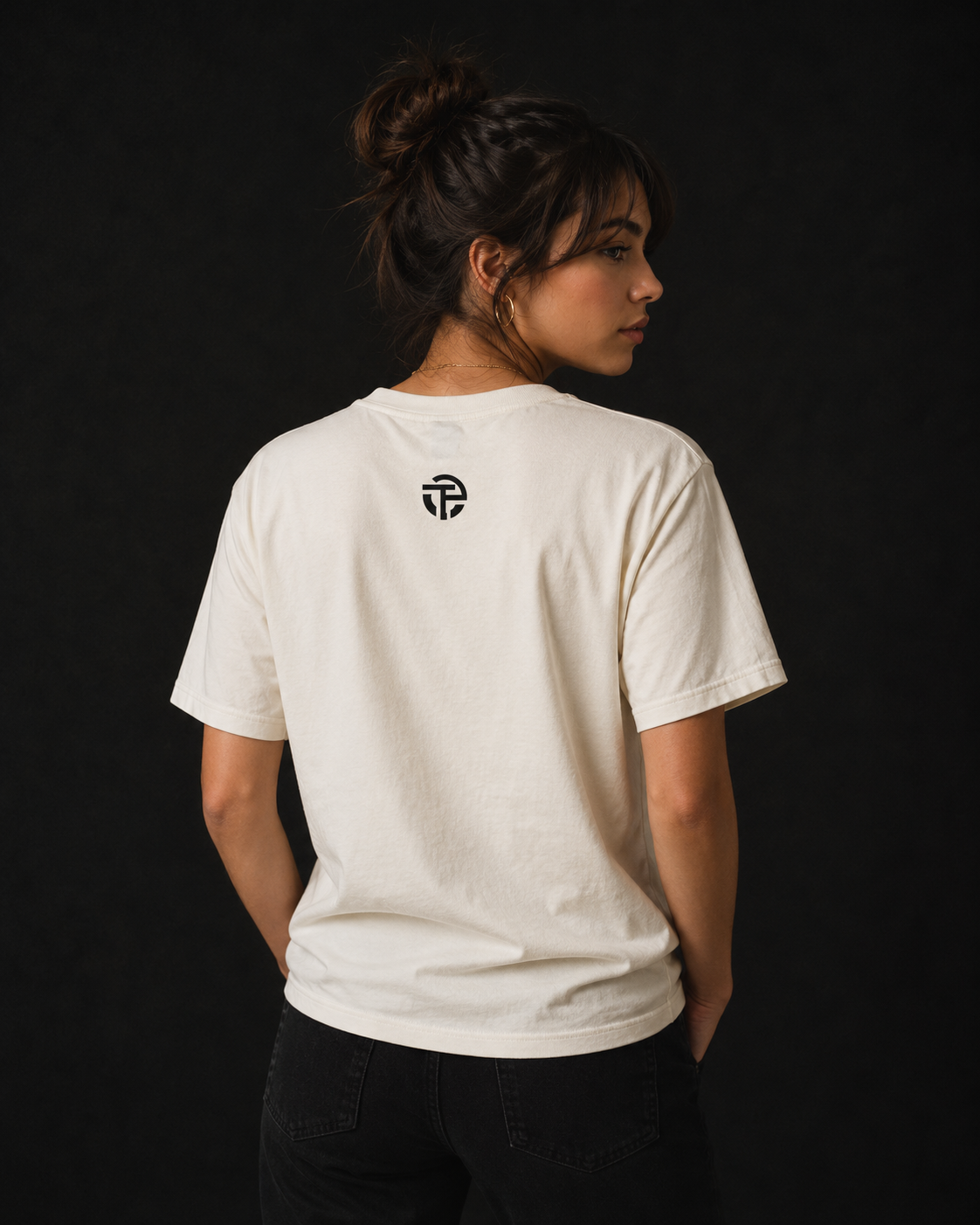 Model wearing the TPC Resilience natural tee, back view