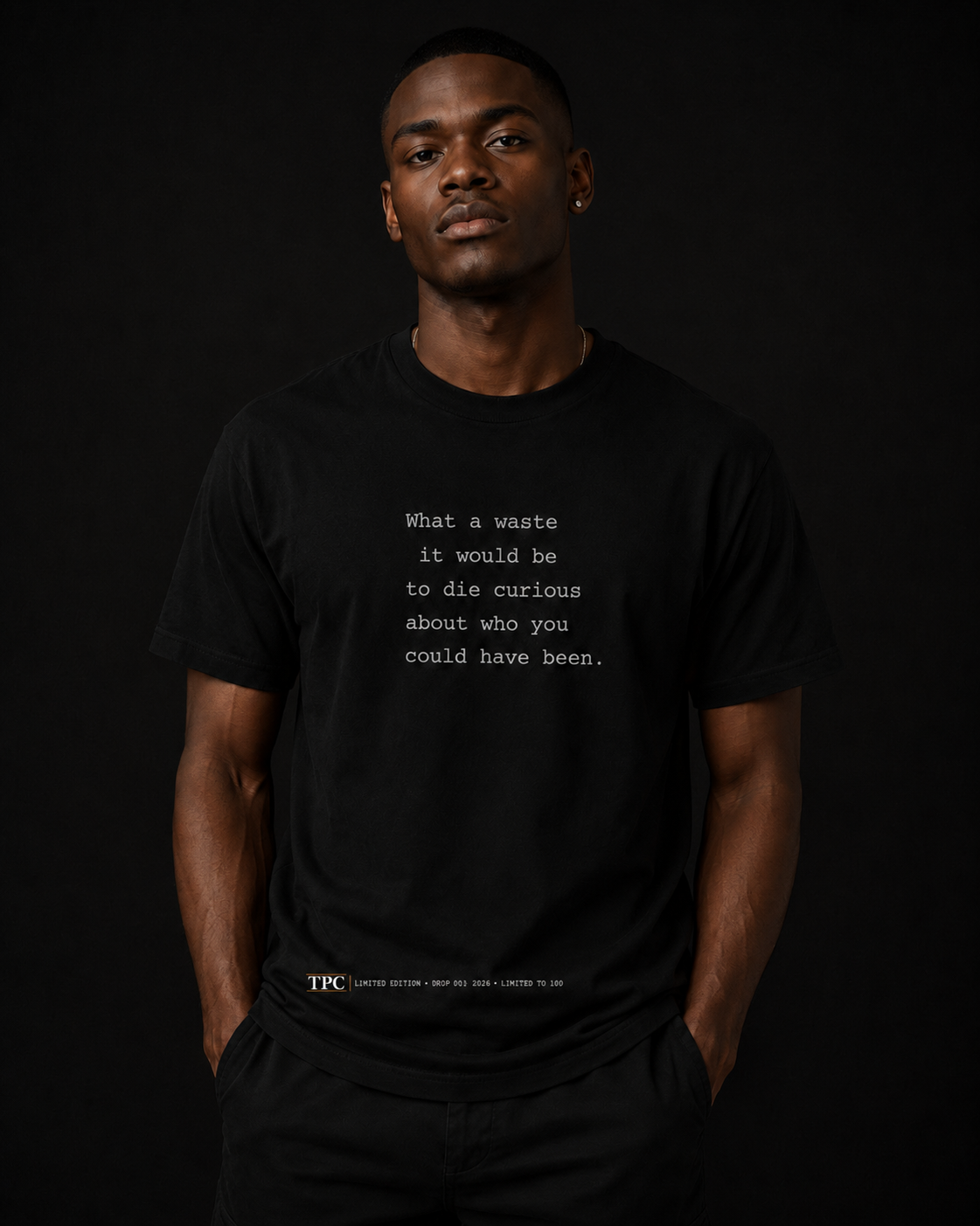 Model wearing the TPC What A Waste black tee, back view