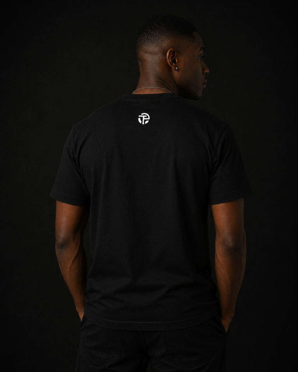 Model wearing the TPC What A Waste black tee, front view of the typed quote