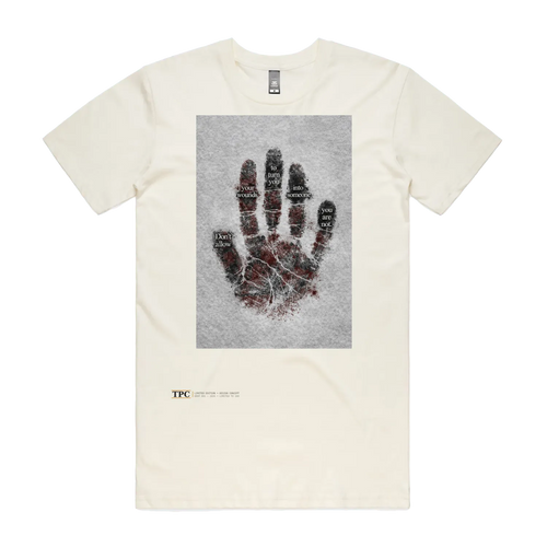 Wounds t-shirt front — TPC tee with a bloodied handprint and the words 'Don't allow your wounds to turn you into someone you are not'