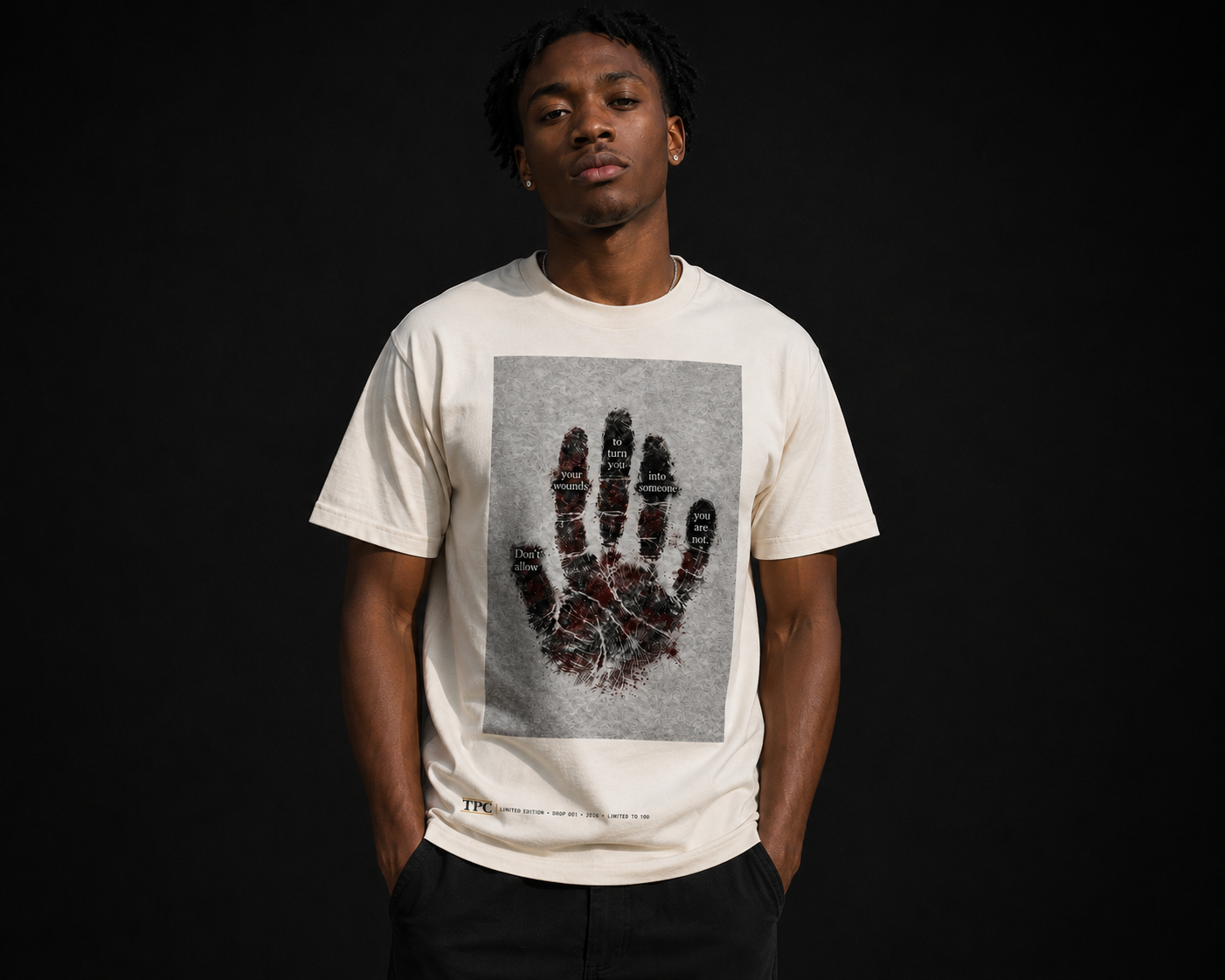 Model wearing the TPC Wounds tee, front view of the handprint artwork